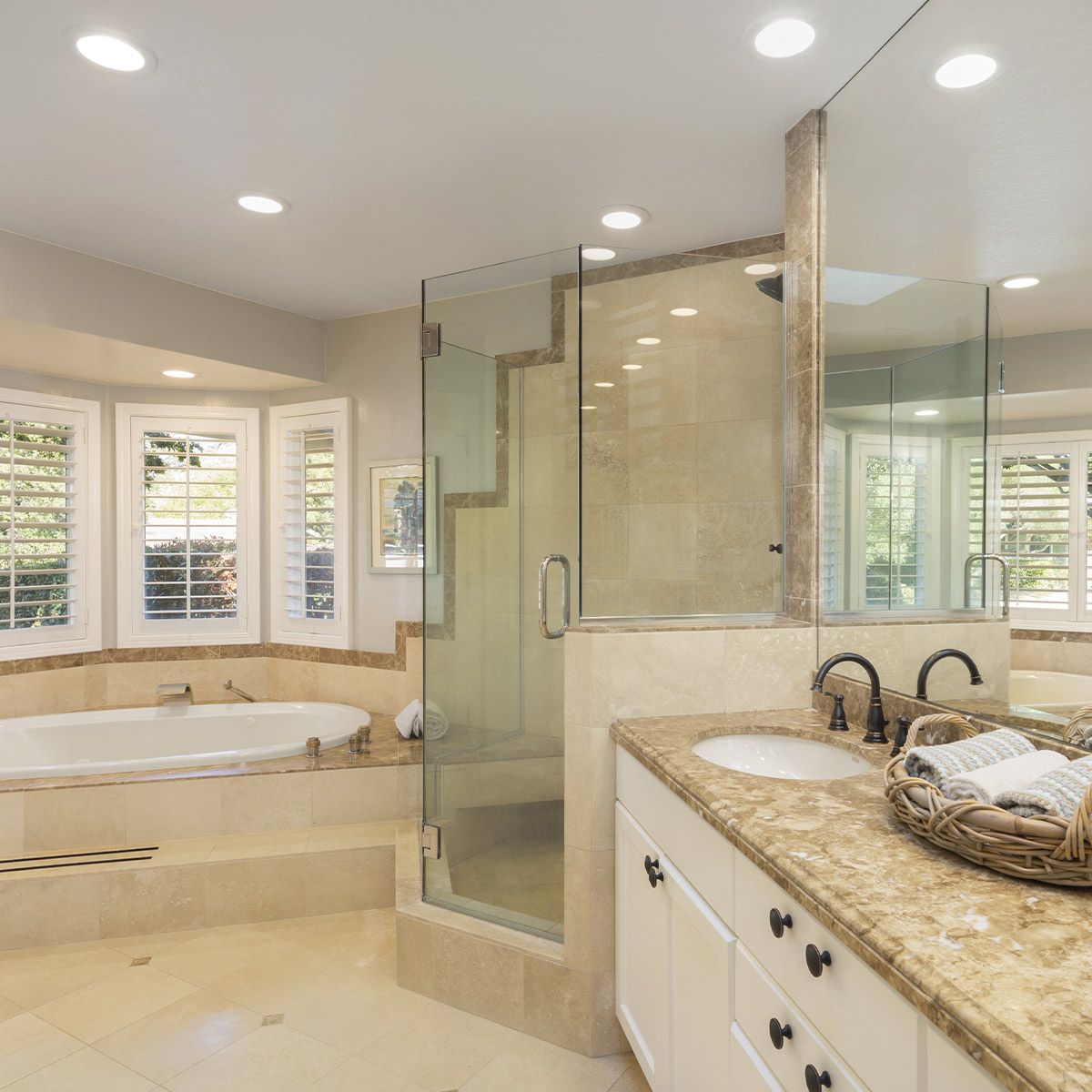 Bright modern bathroom featuring 8" Universal LED Downlight 5-CCT MaxLite RCF with sleek white baffle trim ceiling lighting