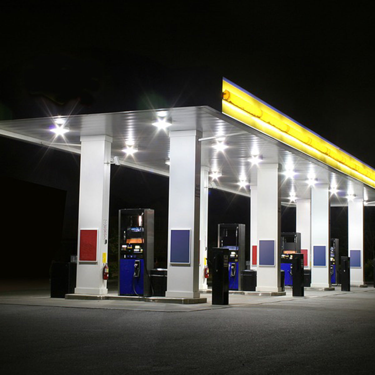 LED Canopy Light 52W MaxLite CPL Series illuminating a gas station canopy at night with bright white light