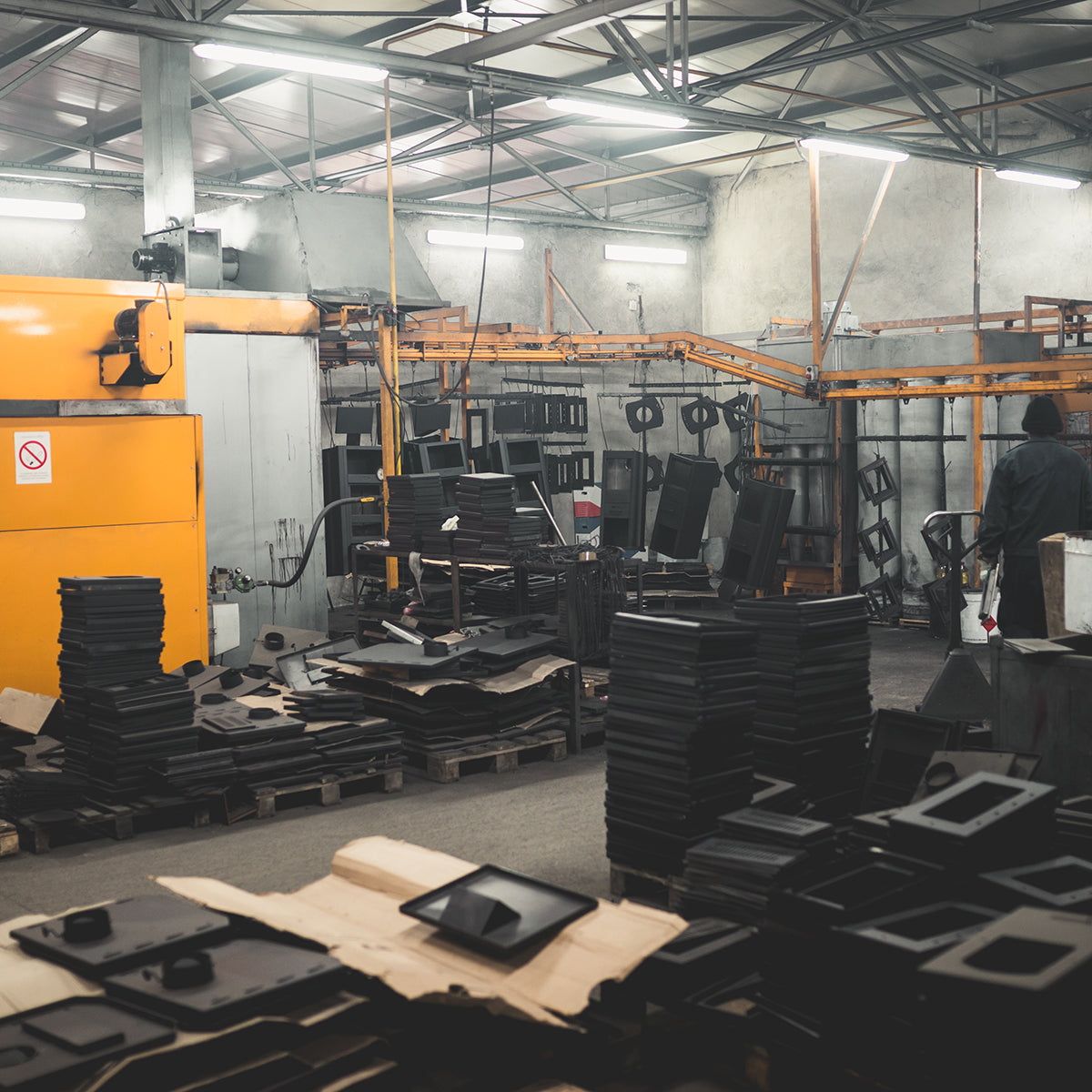 8ft LED Narrow Strip Light installed in a spacious industrial workshop with metal parts and machinery