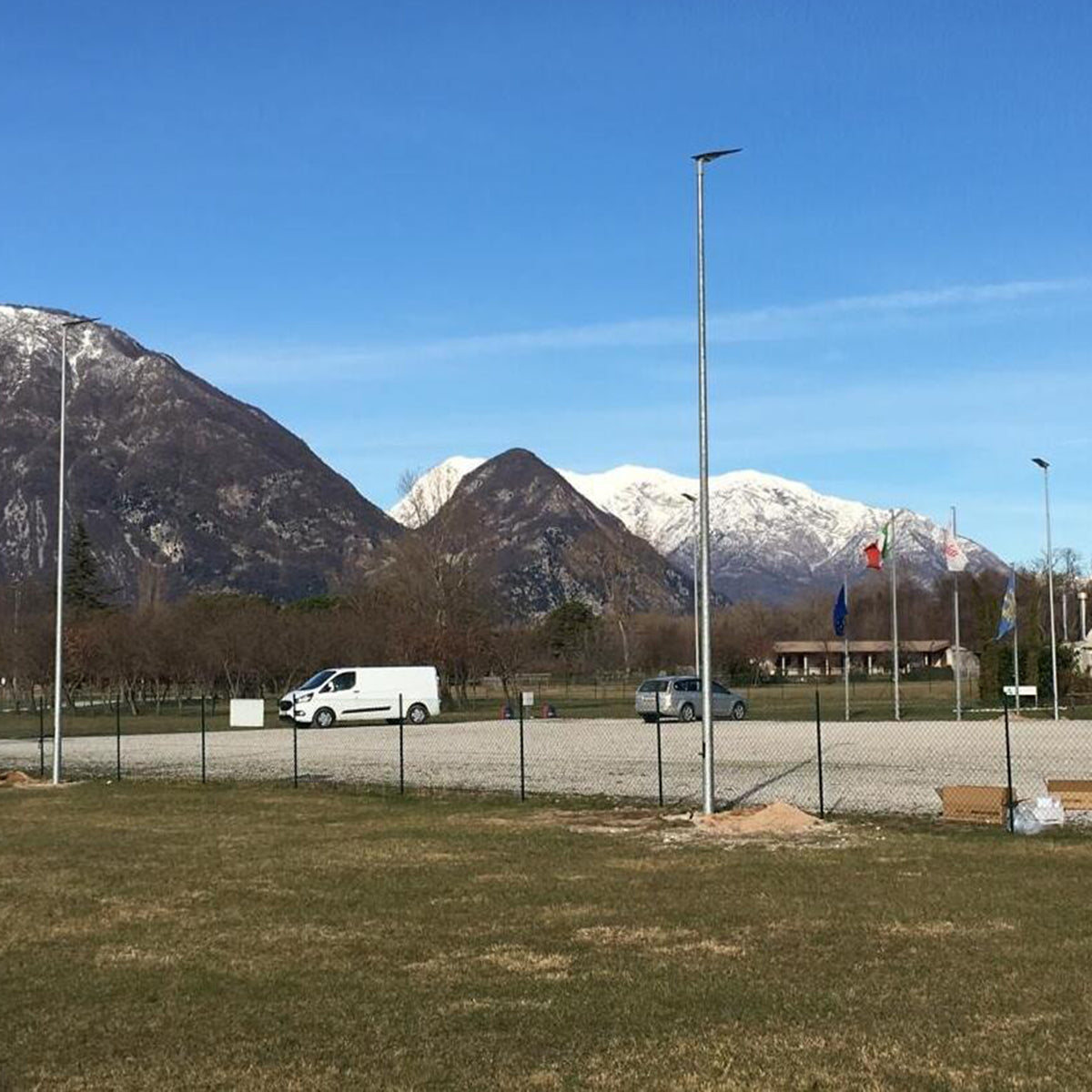 Outdoor installation of Solar LED Area Light with Tiltable Lenses - 100W on tall poles in a mountainous area