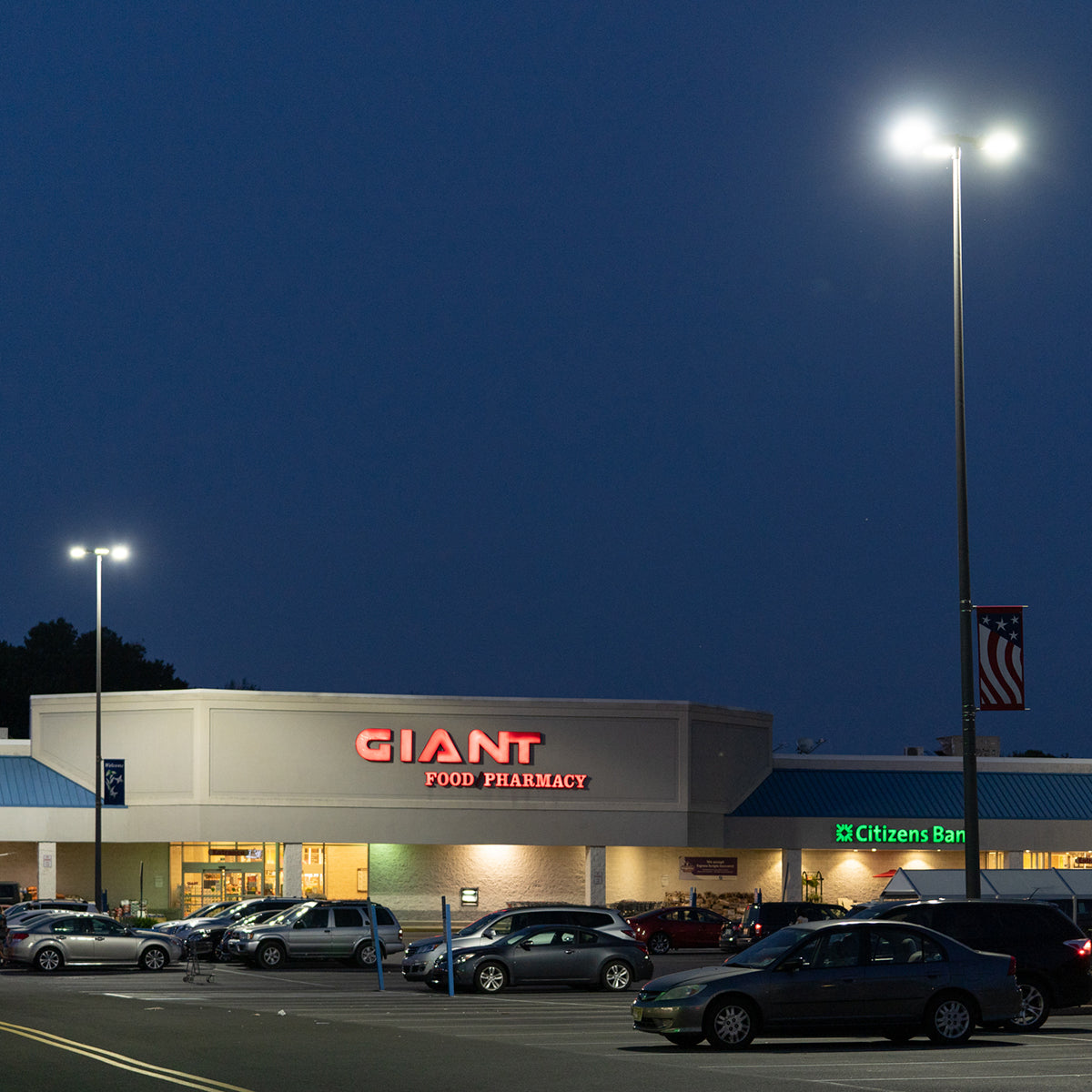 ECO LED Shoebox Area Light 300W 43,500 lumens illuminating a parking lot at night with bright energy-efficient lighting