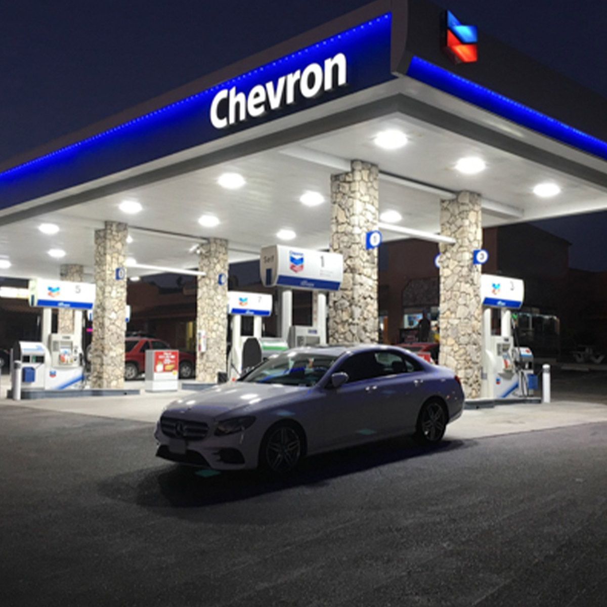 LED Canopy Light - 240W installed at gas station illuminating canopy and fuel pumps at night