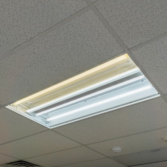 8ft LED Tube 42W 6,930 lm R17D HO installed in ceiling fixture showing bright white light output