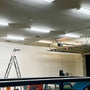 Garage interior illuminated by multiple 4ft LED Tube 5000K 24W Type B lights with a ladder nearby