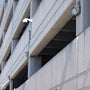 Semi Cutoff LED Wall Pack 125W mounted on parking garage exterior providing bright security lighting