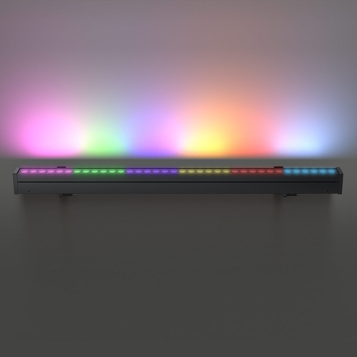 RGBW LED Linear Wall Washer Light mounted on wall displaying vibrant multicolor lighting effects.