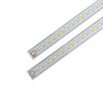 Close-up of two LED magnetic retrofit light strips for 2x4 or 1x4 troffers with quick-connect plug ends.