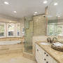 Bright modern bathroom featuring 8" Universal LED Downlight 5-CCT MaxLite RCF with sleek white baffle trim ceiling lighting