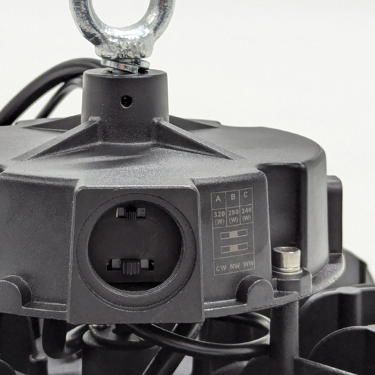 Close-up view of UFO LED High Bay 3-CCT with adjustable wattage switch and metal hanging hook detail