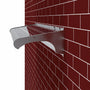 A silver solar sign light mounted against a red brick wall, shown at an angle with a white background visible on the left.