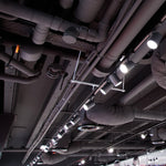 10W LED Trac-Lites™ Track Head – 4-CCT – Juno installed on commercial ceiling with exposed ductwork and pipes
