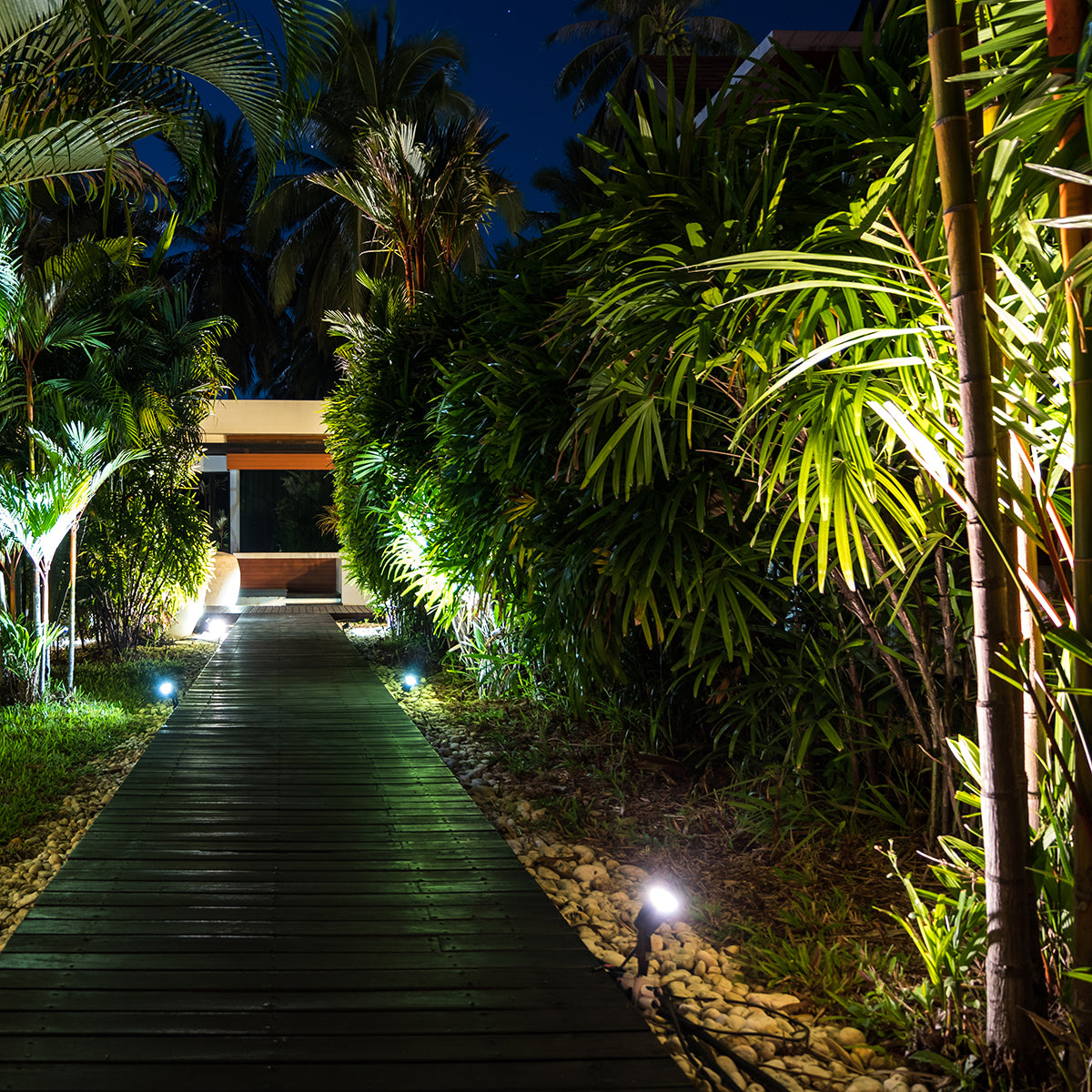 Outdoor pathway illuminated by LED Bullet Flood Light w/Photocell - 3 CCT - 9W/16W/25W - MaxLite BF at night