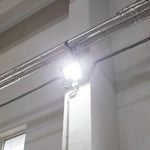 LED Flood Light 100W mounted indoors with bright wide-angle beam illuminating ceiling and wall area