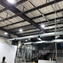 Industrial warehouse ceiling illuminated by multiple UFO LED High Bay 350W lights showing bright energy-efficient lighting