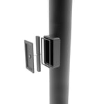 Close-up of the handhole assembly on a Round Steel Light Pole - 4 inch with dark bronze finish and base plate attachments