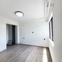 15 Single Ring LED Ceiling Light 5-CCT 22W installed in modern empty room with natural light and wood floor