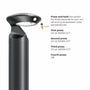 A black outdoor landscape light with a circular head and LED panel, shown next to text explaining how to press and hold the switch to turn it on/off and cycle through color temperatures.