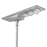 Solar LED Area Light with Tiltable Lenses - 100W mounted on pole with adjustable lenses and solar panel for efficient lighting.