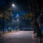 Nighttime city street illuminated by bright LED Street Light 150W with low-glare, clear visibility, and safety features