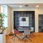 Modern meeting room with 12" Surface Mount LED Downlight - 3-CCT - 24W providing bright, adjustable lighting above table.
