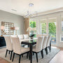 Modern dining room with LED Swirl Chandelier 3-CCT 30W pendant light and elegant white chairs around dark table