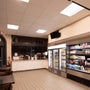Interior of a brightly lit convenience store showcasing 2x4 LED Troffer 3 CCT 30/35/40W RAB SWISH34 lighting panels