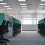 Modern office interior lit by 2x2 LED Troffer 3 CCT 18/25/30W RAB SWISH34 lights with workstations and chairs