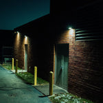Full Cutoff Angle Adjustable LED Wall Pack 67W illuminating a commercial building exterior at night