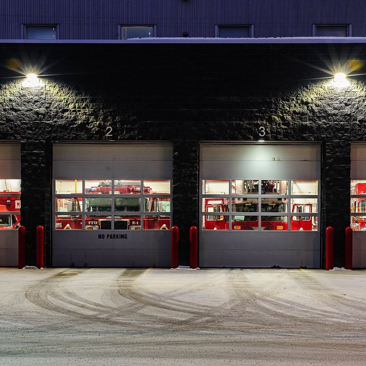 Semi Cutoff LED Wall Pack 125W lighting a fire station exterior with clear, bright illumination at night