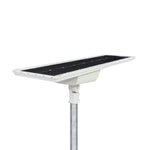 Solar LED Area Light with Tiltable Lenses - 100W mounted on pole with adjustable solar panel for optimal sunlight exposure
