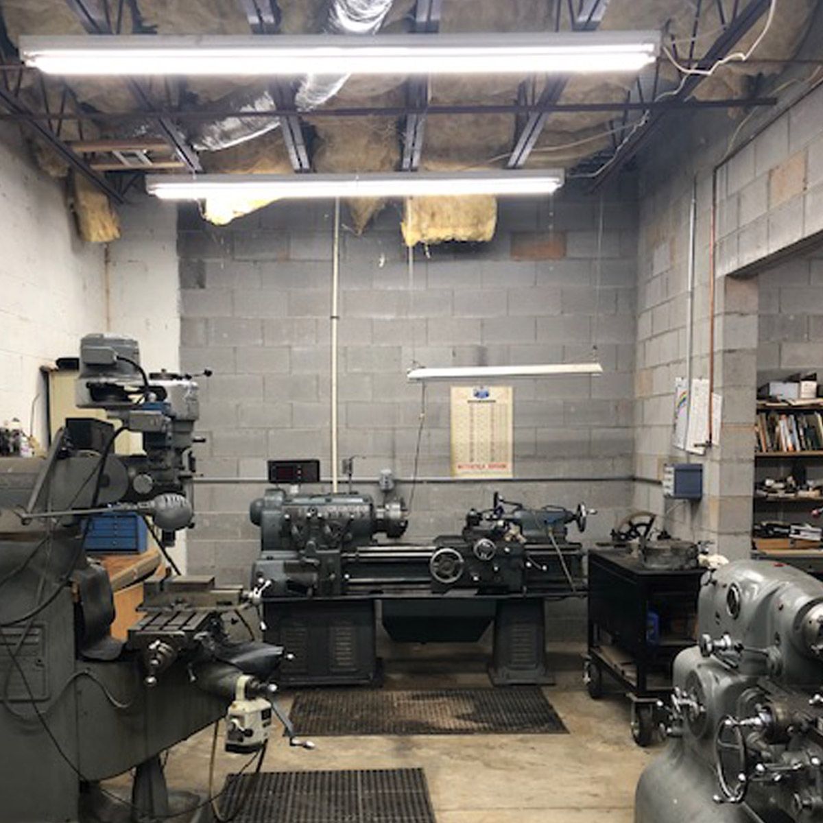 Industrial workshop illuminated by bright 4ft LED Tube 17W Type B lights installed on ceiling fixtures