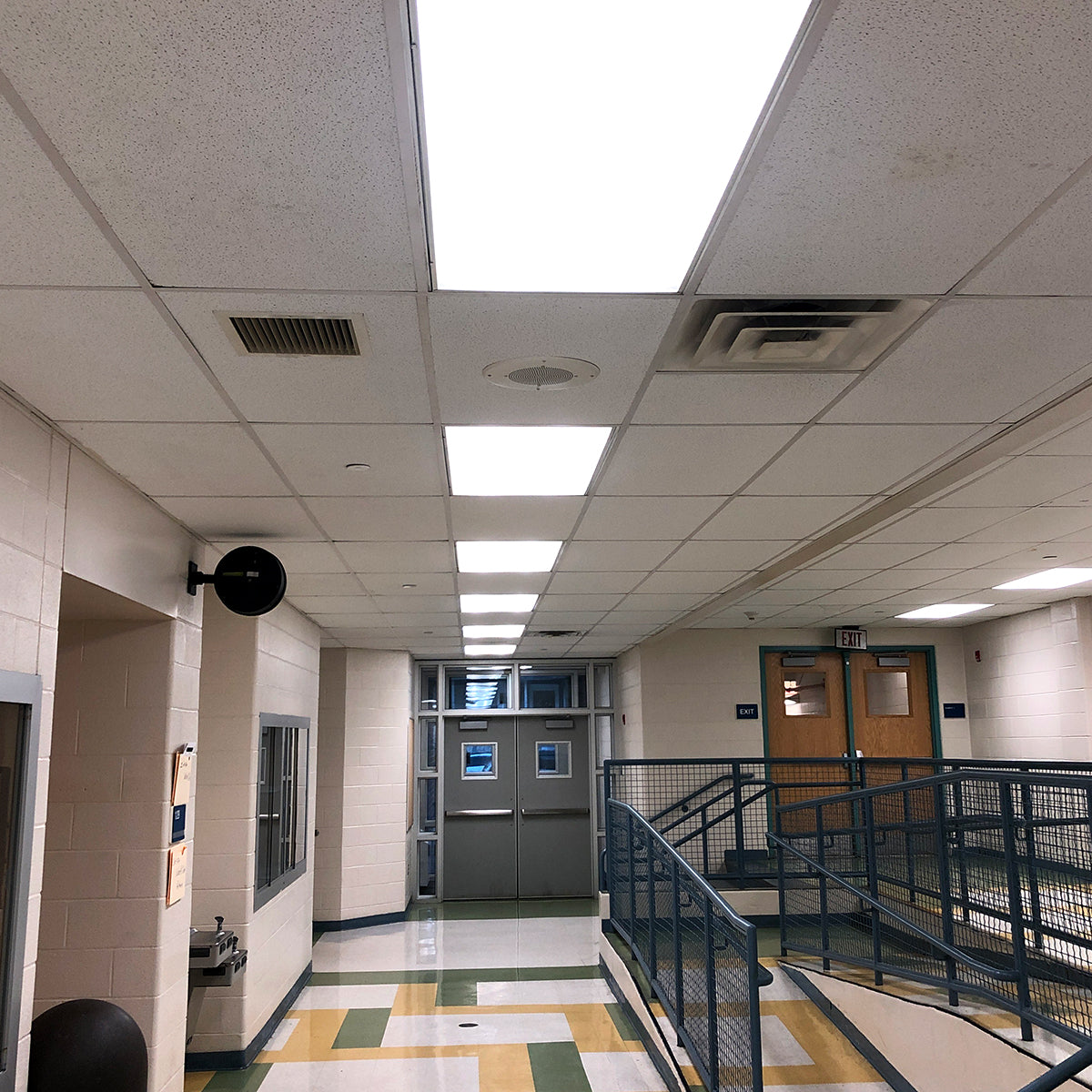 LED Magnetic Retrofit Kit for 2x4 or 1x4 Troffer installed in commercial ceiling hallway lighting panels