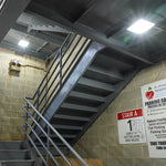 LED Canopy Light - 40W installed in staircase area providing bright, energy-efficient illumination in parking garage setting