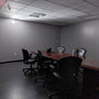 Dual Head LED Emergency Light mounted on office wall providing bright safety lighting in conference room