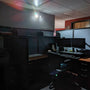 Dual Head LED Emergency Light - Remote Capable illuminating a dark office cubicle with two adjustable lamps during outage.