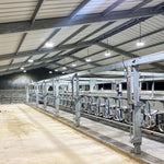 Industrial warehouse illuminated by UFO LED High Bay – 150/120/100/80W fixtures with bright energy-efficient lighting
