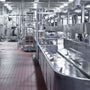 Clean industrial workspace illuminated by bright overhead lighting ideal for Washdown LED High Bay – NSF – 150W use