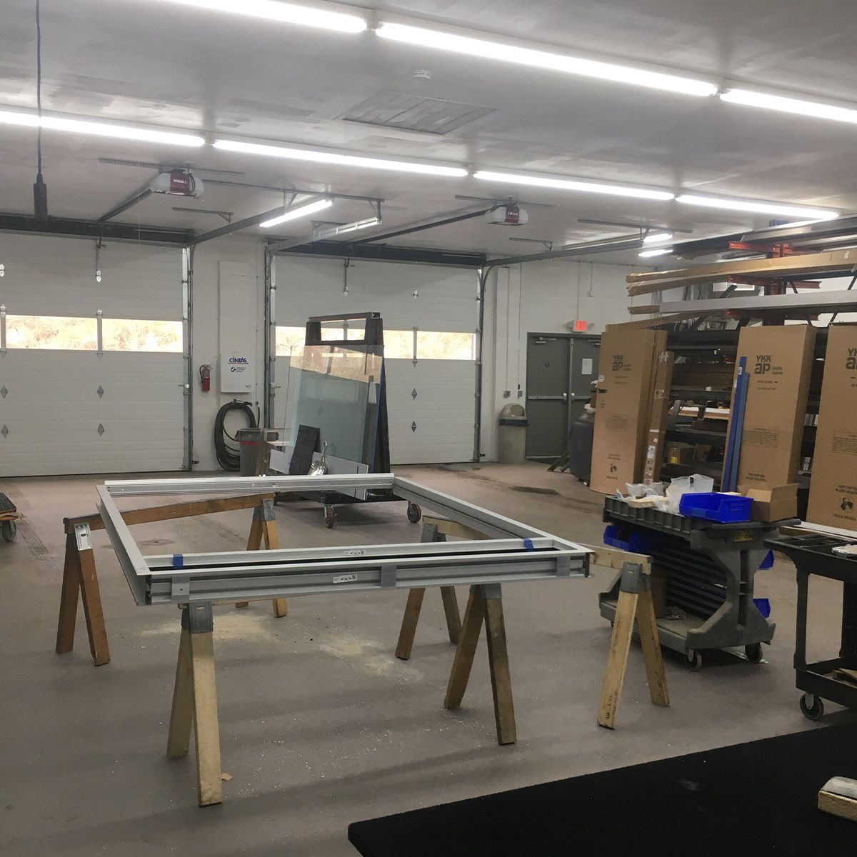 Workshop illuminated by multiple 8ft LED Tube 3 CCT Selectable 40W FA8 Type B lights with bright white lighting