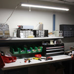 4ft LED Shop Light - Linkable - 43W - Maxlite SL-3 Series mounted above a well-organized illuminated workbench