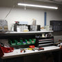4ft LED Shop Light - Linkable - 43W - Maxlite SL-3 Series mounted above a well-organized illuminated workbench
