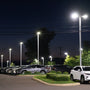 LED Shoebox Area Light 600W illuminating a large parking lot with bright, energy-efficient white light at night