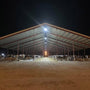 Refurbished High Power 450W Dimmable LED High Bay lighting illuminating a large barn interior at night