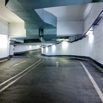 Empty parking garage ramp illuminated by 2ft Parking Garage LED Vapor Tight – 2 CCT lights